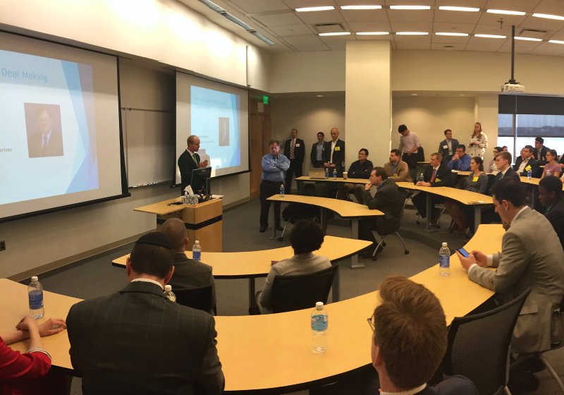 Panoramic view of the audience at the joint event with ACG Maryland, seated at long tables.